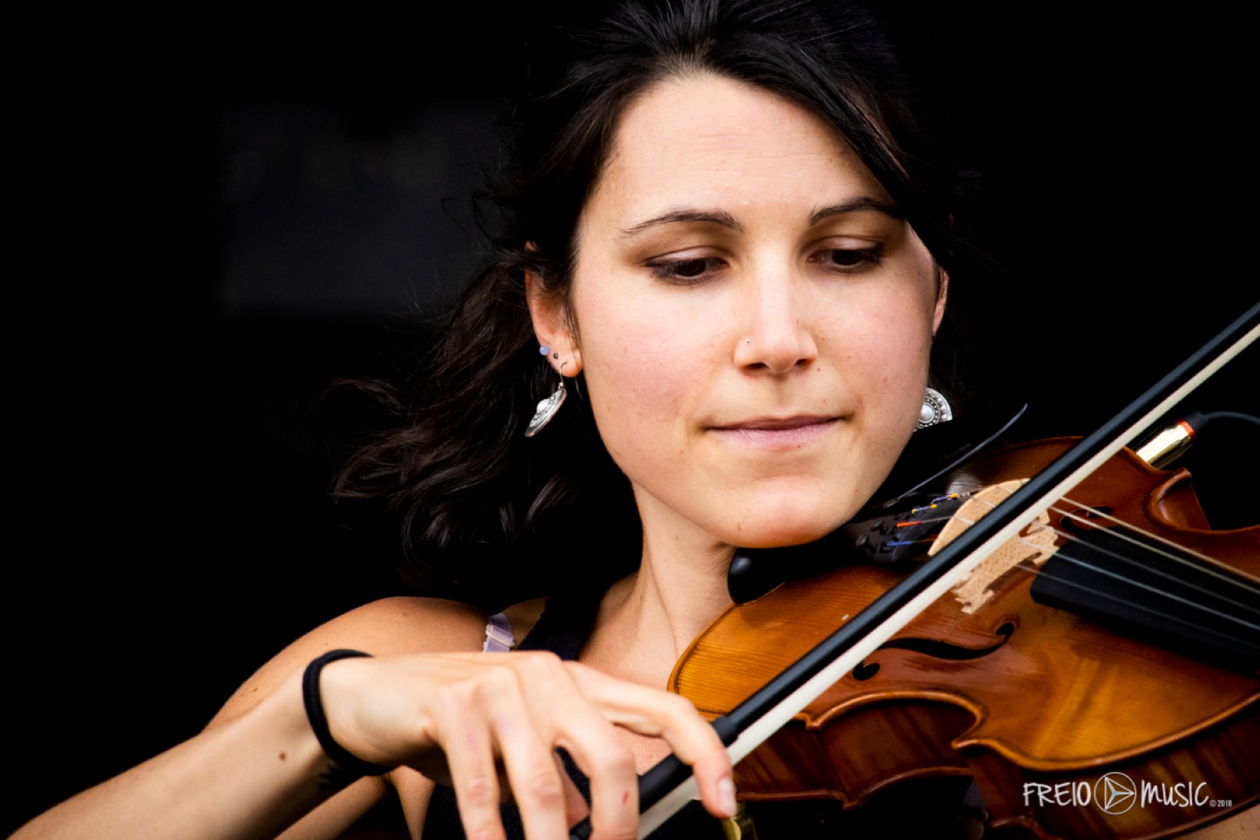 Violinist absorbed in a performance
