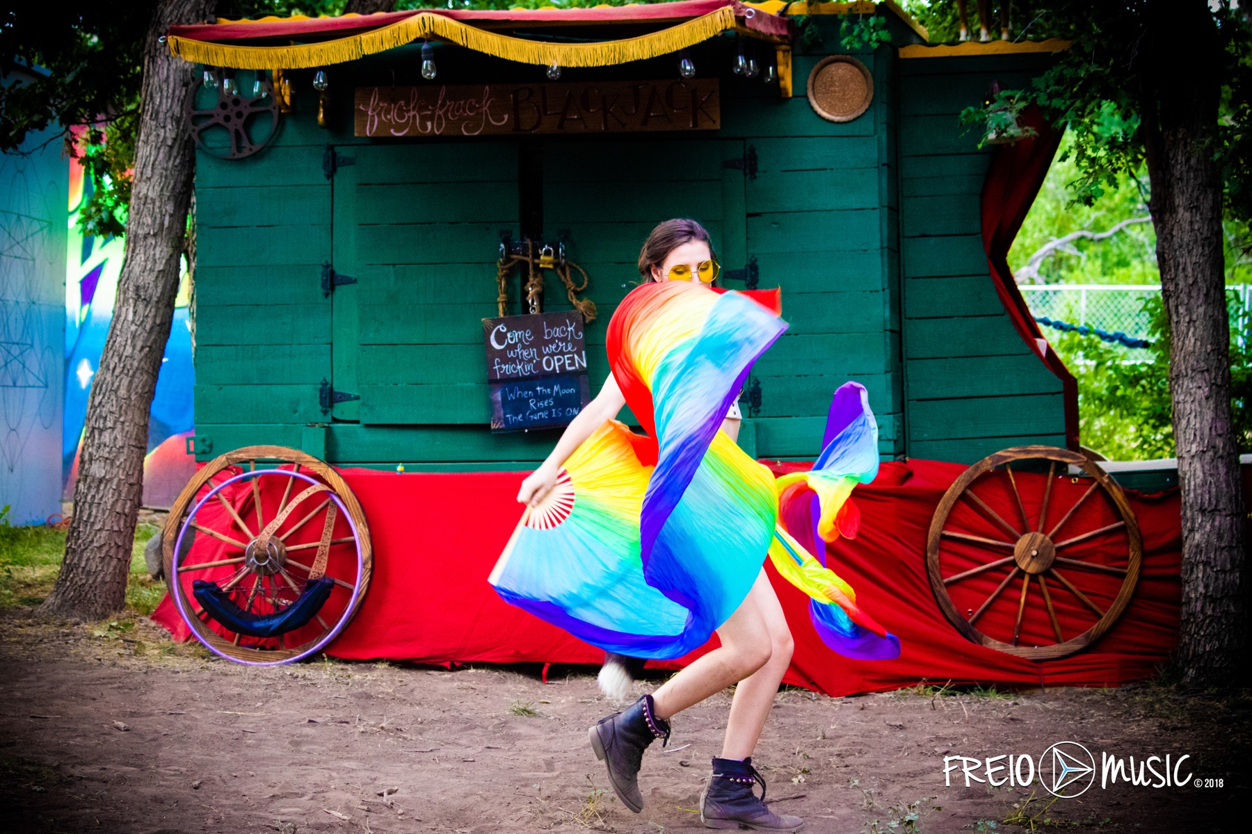 Dancer carrying a rainbow silk veil